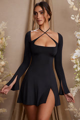 Long Sleeve Cross Over Strap Mini Dress in Black